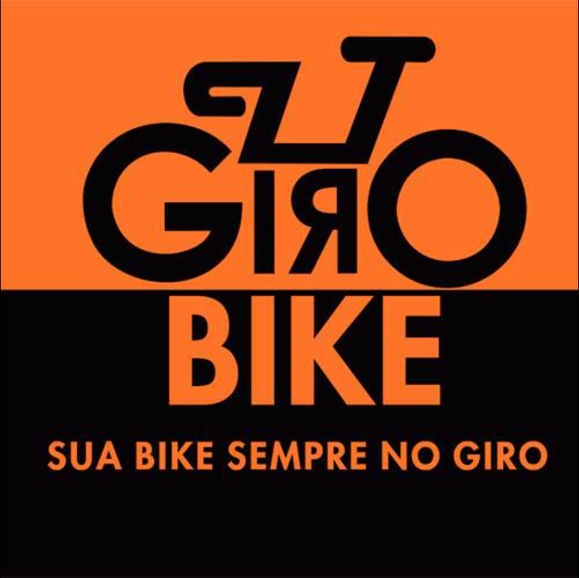 Logo da Giro Bike: a palavra GIRO desenha uma bicicleta, com o G e o O como rodas, sobre fundo laranja e preto